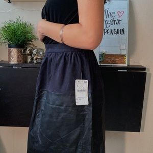 Cute black fabric and leather skirt